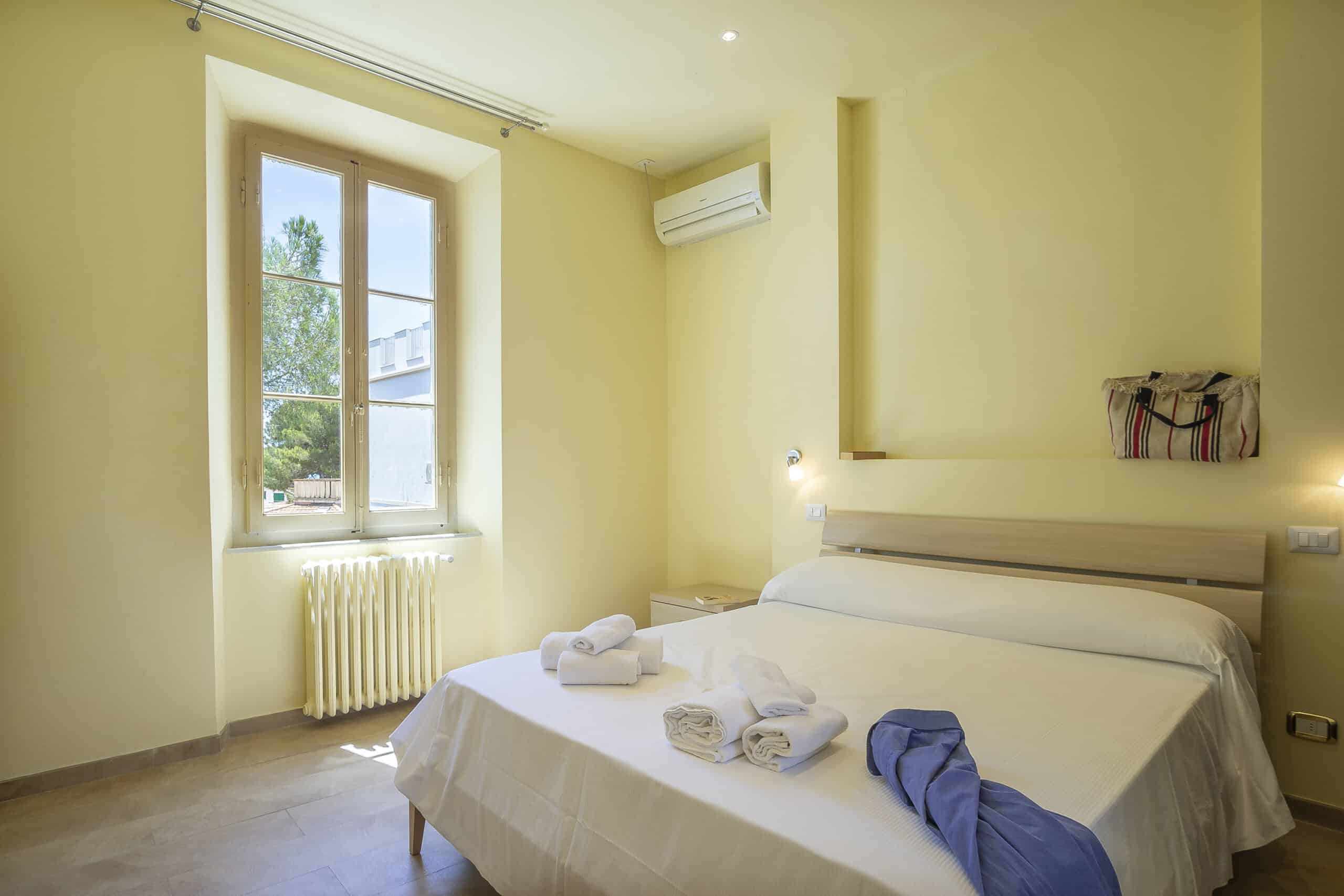 Letto matrimoniale Camera Tripla Hotel Guerrini